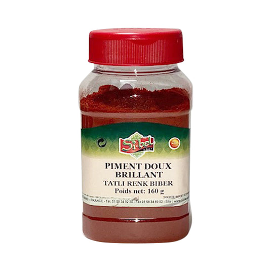 Sibel Piment Doux Moulu 160g, une épice rouge au goût subtil et aromatique. L’emballage met en valeur sa texture fine et sa douceur, idéale pour assaisonner les plats sans les rendre trop épicés."